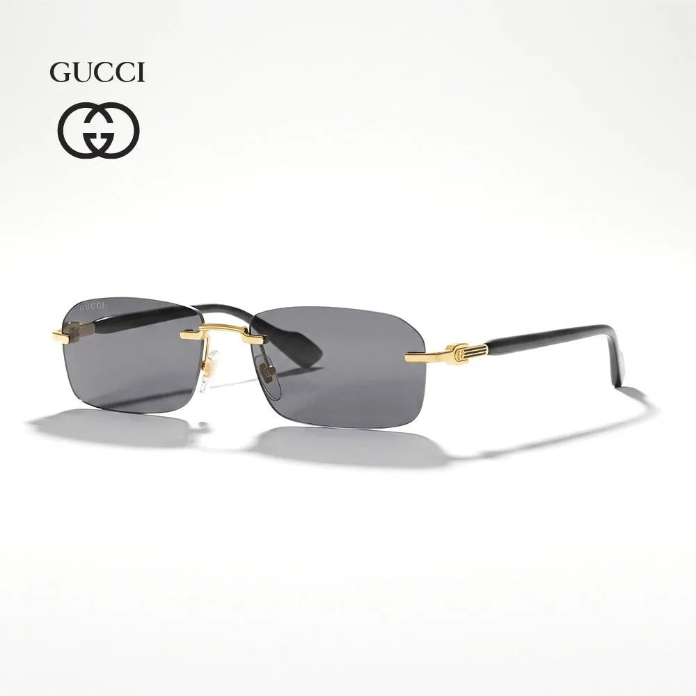 Gucci luxury sunglasses for men with grey lenses and gold-tone metal frame details